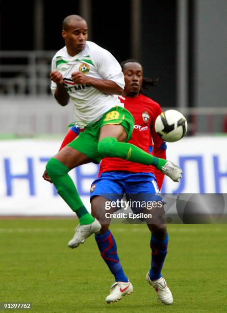 Chidi Odiah of PFC CSKA Moscow battles for the ball with William Boaventura of FC Kuban Krasnodar during the Russian Football League Championship...