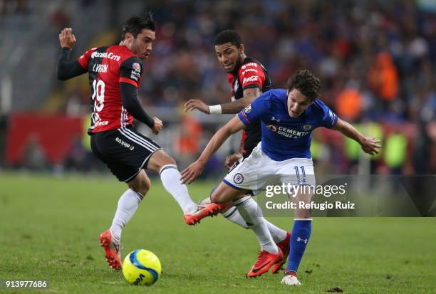 Edwin Gomez of Atlas fights for the ball with Carlos Fierro of Cruz Azul during the 5th round match between Atlas and Cruz Azul as part of the Torneo...