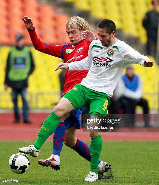 Milos Krasic of PFC CSKA Moscow battles for the ball with Artur Tlisov of FC Kuban Krasnodar during the Russian Football League Championship match...