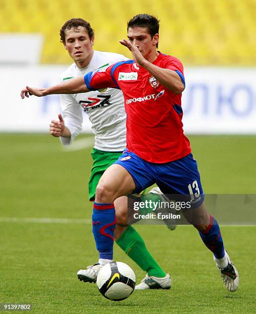 Mark Gonzalez of PFC CSKA Moscow battles for the ball with Maksim Zhavnerchik of FC Kuban Krasnodar during the Russian Football League Championship...