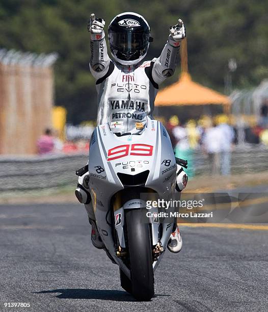 Jorge Lorenzo of Spain and Fiat Yamaha Team celebrates victory in the MotoGP race of the Grand Prix of Portugal in Estoril Circuit on October 4, 2009...