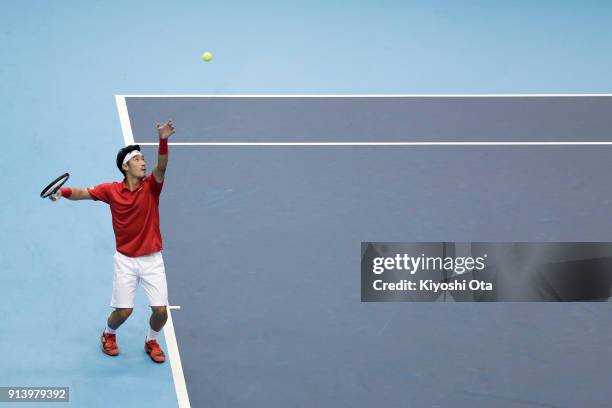 Yuichi Sugita of Japan serves in his singles match against Fabio Fognini of Italy during day three of the Davis Cup World Group first round between...