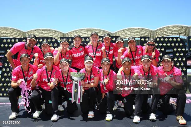 The Sixers pose with the troophy after winning the Women's Big Bash League final match between the Sydney Sixers and the Perth Scorchers at Adelaide...