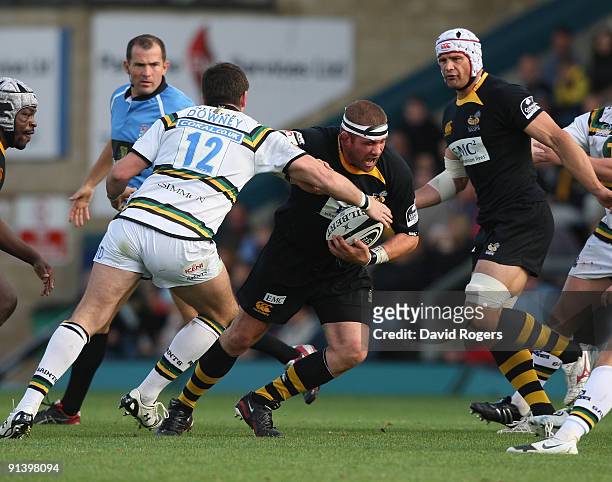 Phil Vickery of Wasps is tackled by James Downey during the Guinness Premiership match between London Wasps and Northampton Saints at Adams Park on...