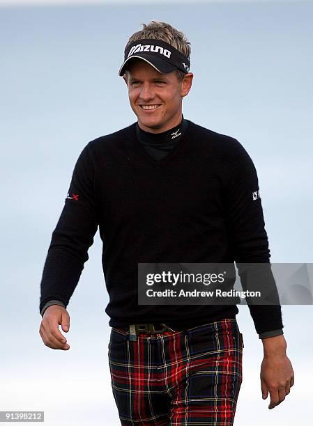 Luke Donald of England acknowledges the crowd after finishing his round on the 18th green during the third round of The Alfred Dunhill Links...