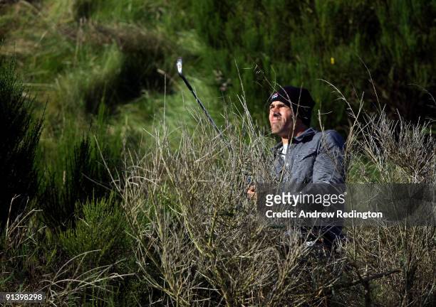 Surfer Kelly Slater plays out from the rough on the fifth hole during the third round of The Alfred Dunhill Links Championship at Kingsbarns Golf...