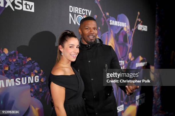 Olympic gymnast Aly Raisman and actor Jamie Foxx attend the 2018 DIRECTV NOW Super Saturday Night Concert at NOMADIC LIVE! at The Armory on February...