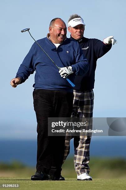 Andrew 'Chubby' Chandler and Darren Clarke of Northern Ireland on the 18th green during the third round of The Alfred Dunhill Links Championship at...