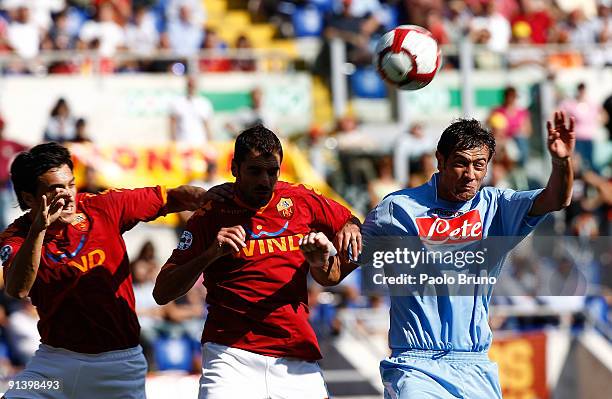 Jesus Datolo of SSC Napoli and Nicolas Burdisso and Simone Perrotta of AS Roma compete for the ball during the Serie A match between AS Roma and SSC...