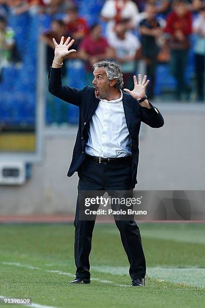 Roberto Donadoni the coach of SSC Napoli reacts during the Serie A match between AS Roma and SSC Napoli at Olimpico Stadium on October 4, 2009 in...