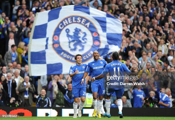Nicolas Anelka of Chelsea celebrates with teammates Deco and Didier Drogba after scoring the opening goal during the Barclays Premier League match...