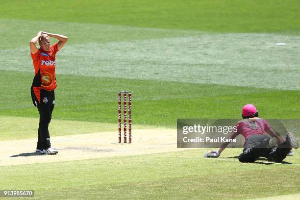 Katherine Brunt of the Scorchers reacts after a run-out attempt foe Ellyse Perry of the Sixers during the Women's Big Bash League final match between...