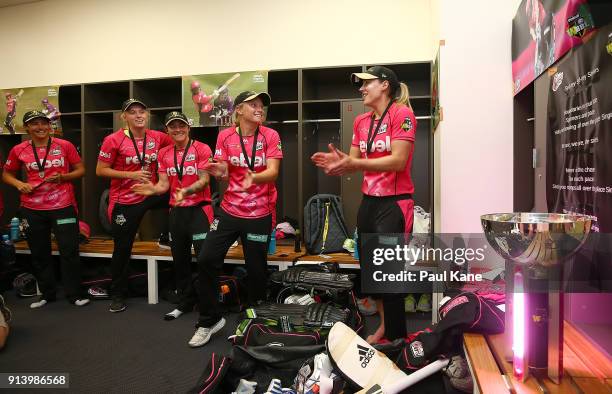 Sara McGlashan, Sarah Coyte, Kim Garth, Alyssa Healy and Ellyse Perry of the Sixers sing the team song after winning the Women's Big Bash League...