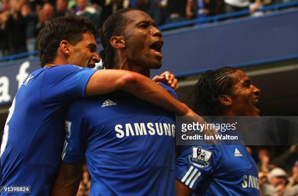 Florent Malouda of Chelsea celebrates with team mates Didier Drogba and Michael Ballack as he scores their second goal during the Barclays Premier...