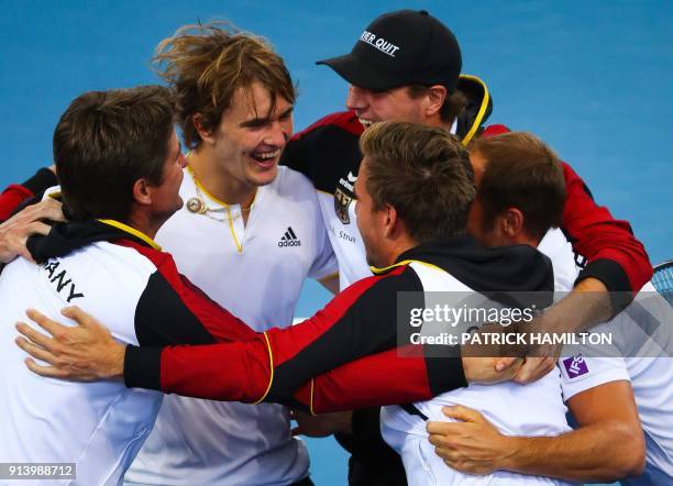 Alexander Zverev of Germany and his team celebrate his victory over Nick Kyrgios of Australia following their forth round rubber of the Davis Cup...