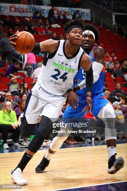 Justin Patton of the Iowa Wolves drives around Rashawn Thomas of the Oklahoma City Blue in an NBA G-League game on February 3, 2018 at the Wells...