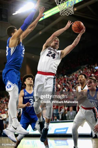 Corey Kispert of the Gonzaga Bulldogs goes to the basket against Yoeli Childs of the BYU Cougars in the second half at McCarthey Athletic Center on...