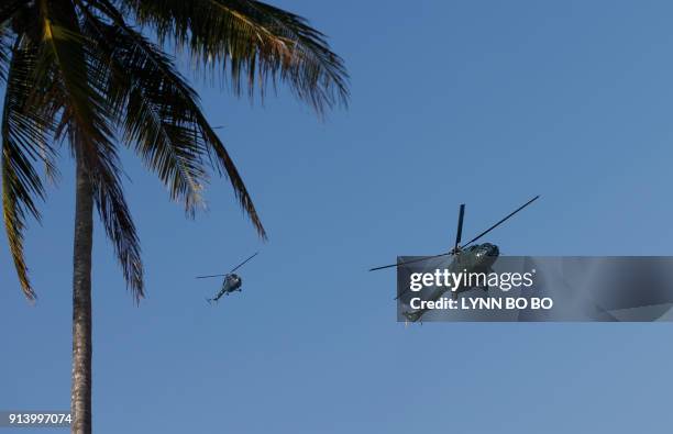 In this photograph taken on February 3, 2018 Myanmar Air Force helicopters take part during the second day of 'Sin Phyu Shin' joint military...