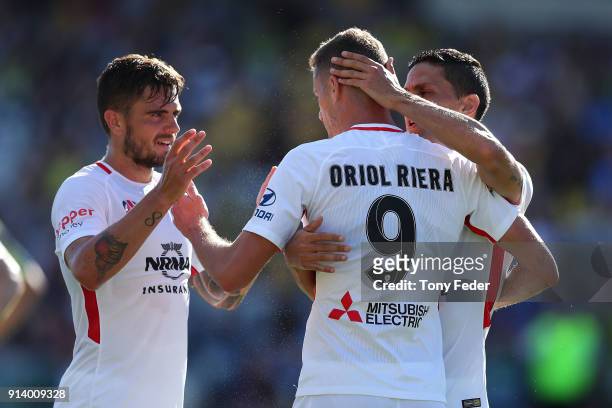 Oriol Riera of the Wanderers celebrates a goal with team mates during the round 19 A-League match between the Central Coast Mariners and the Western...