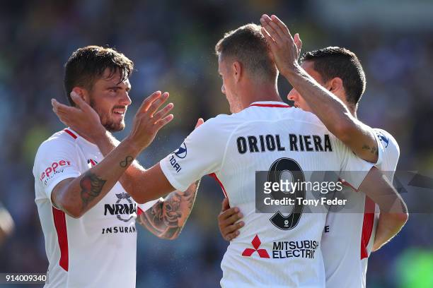 Oriol Riera of the Wanderers celebrates a goal with team mates during the round 19 A-League match between the Central Coast Mariners and the Western...