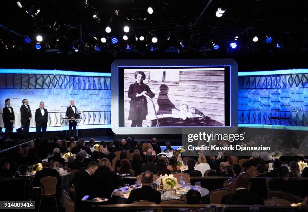 Honoree Michael Apted accepts the DGA Honorary Lifetime Member Award from DGA Senior Advisor Jay D. Roth onstage during the 70th Annual Directors...