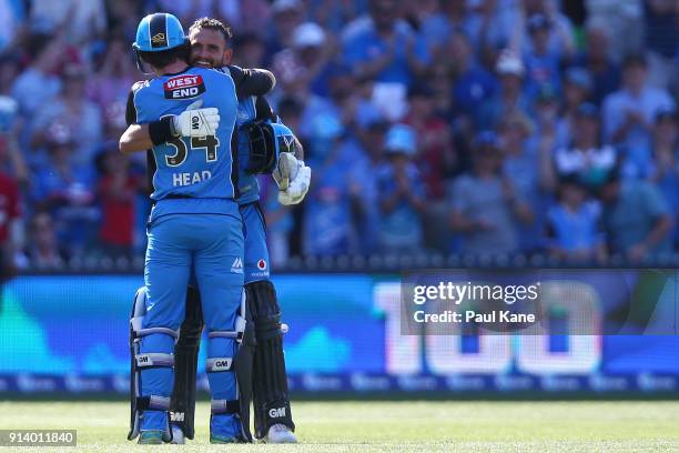 Jake Weatherald of the Strikers celebrates his century with Travis Head during the Big Bash League Final match between the Adelaide Strikers and the...