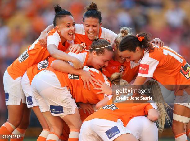 The Brisbane team celebrate their third goal during the round 14 W-League match between the Brisbane Roar and Canberra United at Suncorp Stadium on...