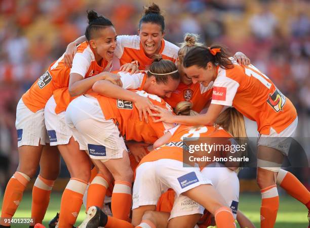 The Brisbane team celebrate their third goal during the round 14 W-League match between the Brisbane Roar and Canberra United at Suncorp Stadium on...