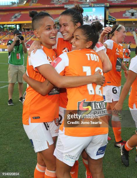 Brisbane players celebrate winning the Minor Premiership after the win during the round 14 W-League match between the Brisbane Roar and Canberra...