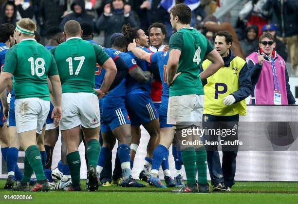 Teddy Thomas of France celebrates scoring a try with Benjamin Fall and teammates during the NatWest 6 Nations match between France and Ireland at...