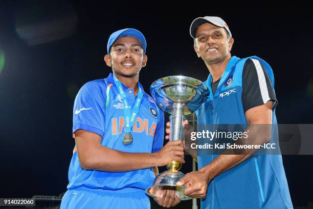 Captain Prithvi Shaw of India and Head Coach Rahul Dravid of India pose with the trophy after their win in the ICC U19 Cricket World Cup Final match...