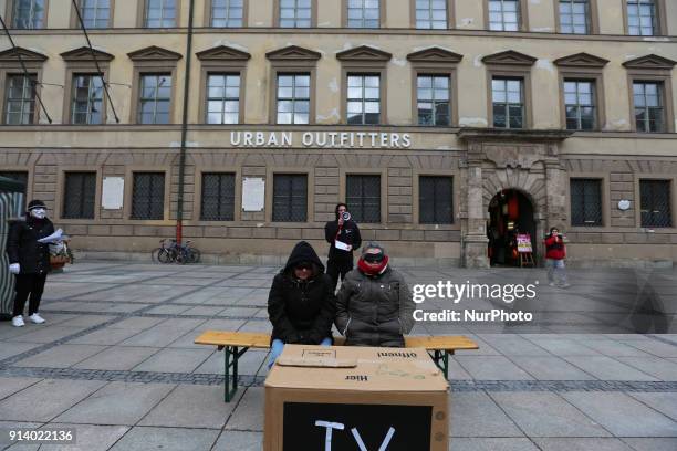 'Sleeping' TV watching people while in the back there's the the action. The anonymous group Independent Anons made an action in Munich, Germany, on 3...