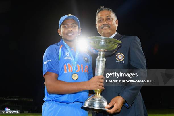 Captain Prithvi Shaw of India and manager Rajesh Verma of India pose with the trophy after their win in the ICC U19 Cricket World Cup Final match...
