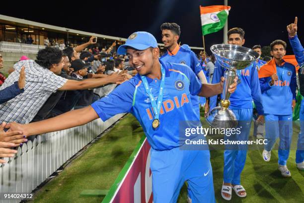 Captain Prithvi Shaw of India greets fans while he holds the trophy after the win in the ICC U19 Cricket World Cup Final match between Australia and...