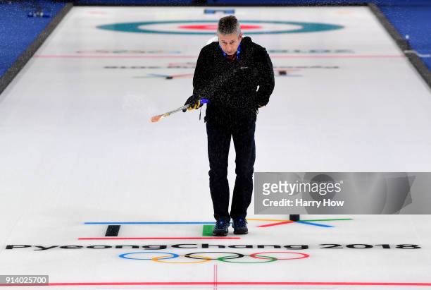 Mark Callan sprays water as he prepares the ice at the Gangneung Curling Centre ahead of the PyeongChang 2018 Winter Olympics on February 4, 2018 in...