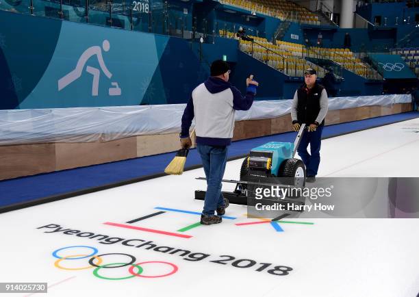 Shawn Olesen and Eric Montford prepare the ice at the Gangneung Curling Centre ahead of the PyeongChang 2018 Winter Olympics on February 4, 2018 in...