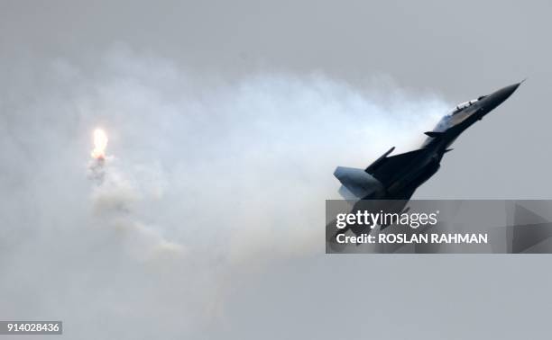 Royal Thai Air Force SAAB JAS 39 Gripen fighter aircraft performs an aerial display during a media preview for the Singapore Airshow in Singapore on...