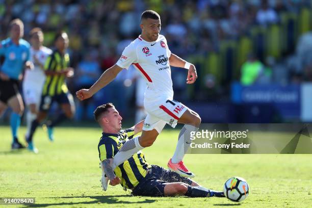 Storm Roux of the Mariners contests the ball with Jaushua Sotirio of the Wanderers during the round 19 A-League match between the Central Coast...