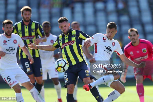 Oriol Riera of the Wanderers contests the ball with Blake Powell of the Mariners during the round 19 A-League match between the Central Coast...