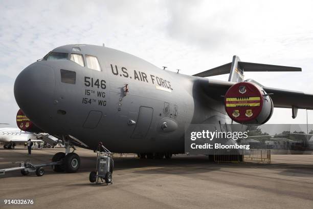An United States Air Force C-17 Globemaster III aircraft, manufactured by Boeing Co., stands on display at the Singapore Airshow held at the Changi...