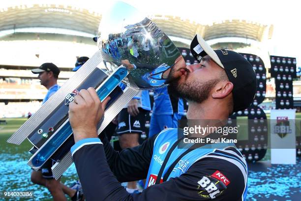 Jake Weatherald of the Strikers kisses th etrophy after winning the Big Bash League Final match between the Adelaide Strikers and the Hobart...