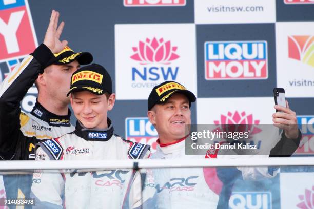 Grant Denyer celebrates on the podium during the 2018 Bathurst 12 Hour Race at Mount Panorama on February 4, 2018 in Bathurst, Australia.