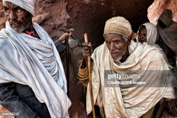 Pilgrims walking through one of the tunnels that connect the churches in Lalibela. During the first days of January, thousands of Ethiopian Orthodox...