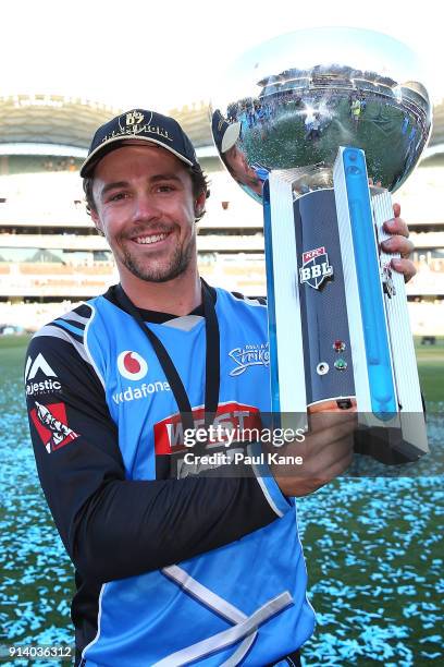 Travis Head of the Strikers poses with the trophy after winningthe Big Bash League Final match between the Adelaide Strikers and the Hobart...