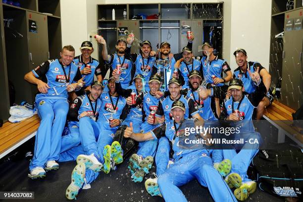 The Strikers celebrate in the change rooms after defeating the Hurricanes during the Big Bash League Final match between the Adelaide Strikers and...