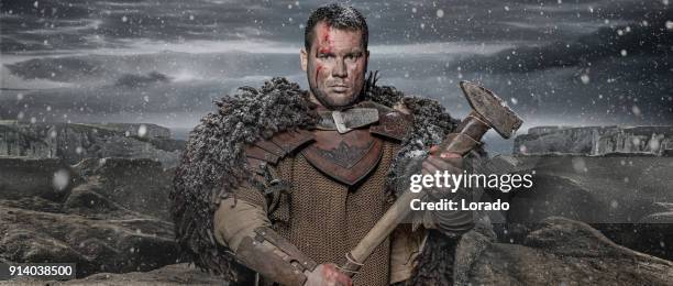 hammer wielding viking warrior brunette male in wild highland countryside - chain mail textile stock pictures, royalty-free photos & images