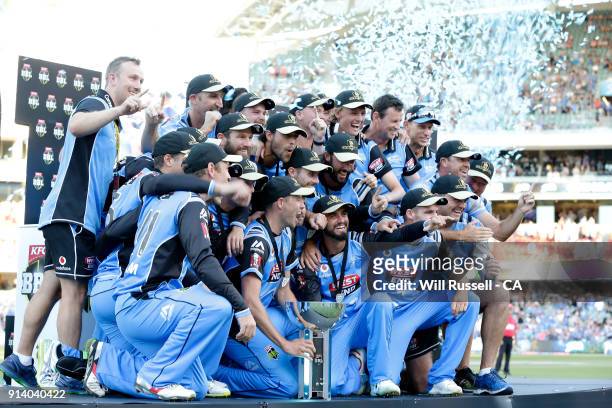 The Strikers celebrate with the trophy after winning the Big Bash League Final match between the Adelaide Strikers and the Hobart Hurricanes at...