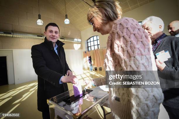 Les Republicains right-wing party candidate, Ian Boucard, casts his ballot during the second round of the legislative by-election in the 1st...