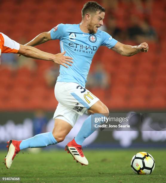 Melbourne player Scott Jamieson runs with the ball during the round 19 A-League match between the Brisbane Roar and Melbourne City at Suncorp Stadium...