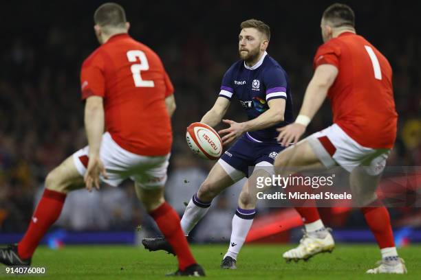 Tommy Seymour of Scotland looks to pass as Ken Owens and Rob Evans close in during the NatWest Six Natons match between Wales and Scotland at the...